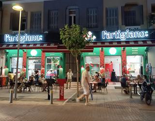 Sitting area on the sidewalk l'artigiano pizza