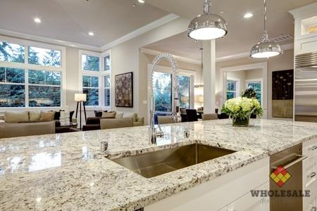 white kitchen design features large bar