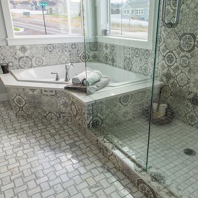 fully remodeled bathroom with stone flooring